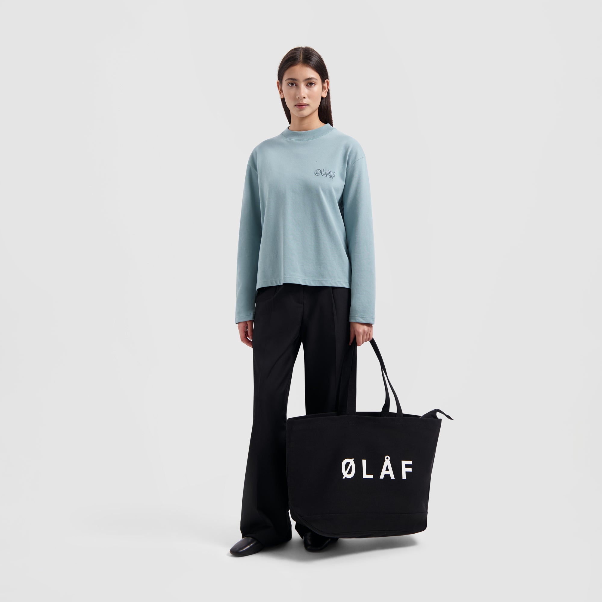 WMN Outline Logo LS - Light Teal Blue
